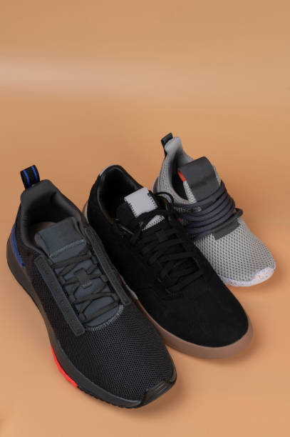 istock Row of different size sport shoes 1616633729