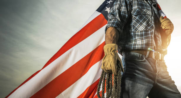 American West Workforce Concept American West Workforce Conceptual Photo with Rancher and US National Flag patriotic man stock pictures, royalty-free photos & images