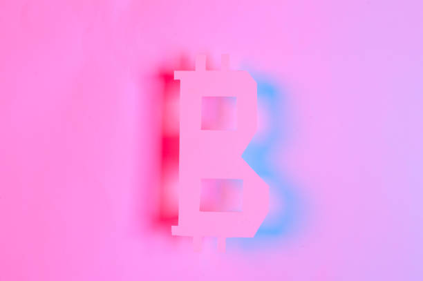 istock Paper cut bitcoin currency symbol in red blue neon light 1616644560