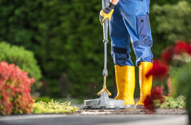 istock Caucasian Garden Keeper in His 40s Washing Concrete Bricks Driveway Using a Modern Pressure Washer 1616645703