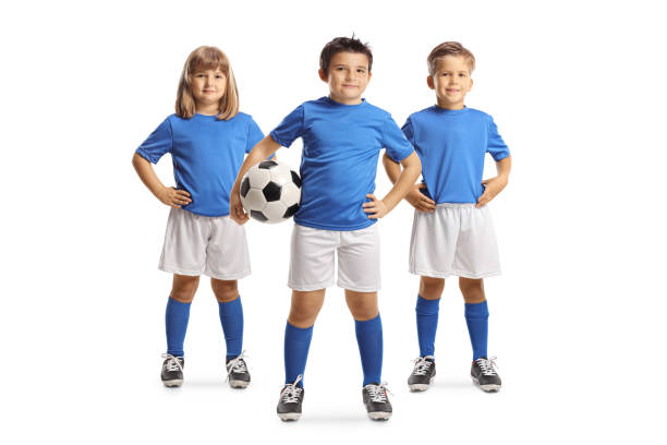 istock Group of children in football kits posing with a ball 1616660607