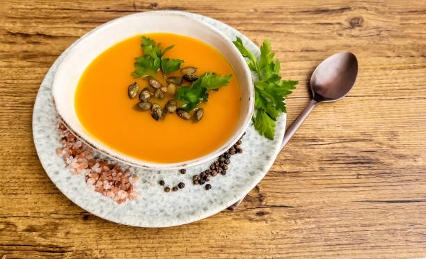 istock Pumpkin, carrot cream soup in a bowl 1616662367