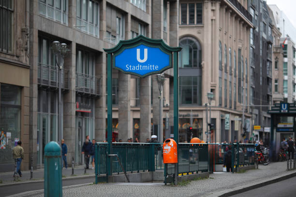Germany, Berlin, Berlin Central, Unter Den Linden,  May 15, 2024 -Bus stop sign against building and clear sky