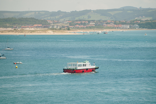A passenger boat crossing Santander bay in Cantabria, Spain