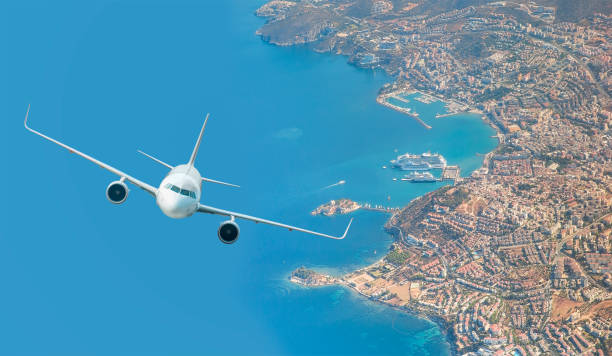 istock White Passenger plane fly up over take-off runway from airport 1616672114