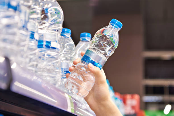istock Drinking water in hand at shop 1616673263