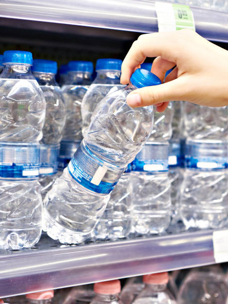istock Drinking water in hand at shop 1616674813