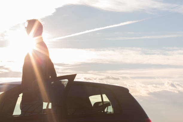 istock Man looks out form car door 161668080
