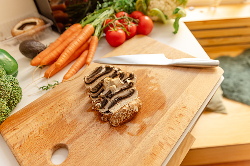 Sliced portobello mushroom in the kitchen - Stock Photo