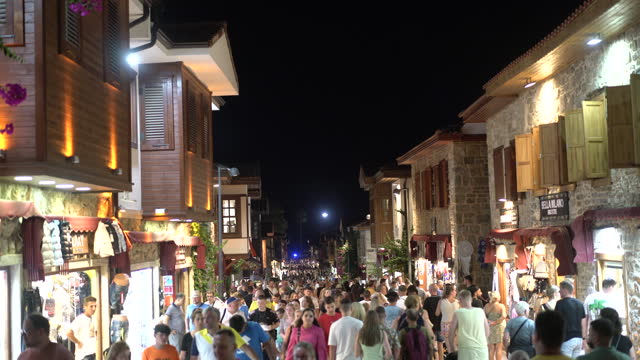 People walking in new Side town street at night