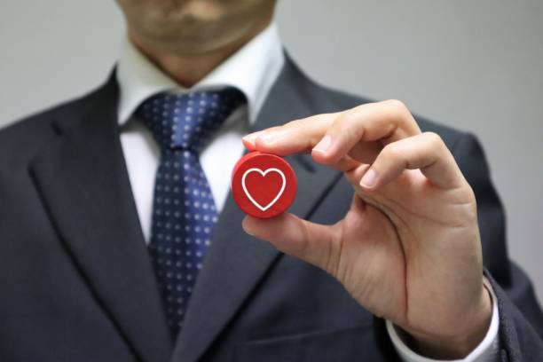 istock Businessman with heart-shaped building blocks 1616721505