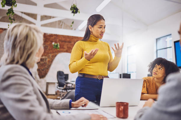 istock Female executive explaining business plans at team meeting 1616721579