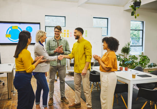 istock Senior manager and executive shaking hands and clapping in office 1616721619