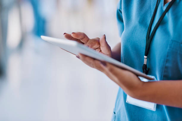 istock Close-up of female nurse using digital tablet 1616721907