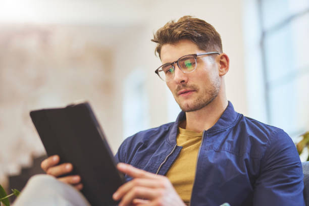istock Portrait of businessman with eyeglasses using digital tablet 1616722158