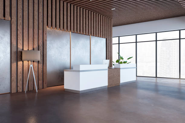 istock Simple wooden and concrete office lobby interior with reception desk, panoramic window with city view and other objects. Waiting area and interior designs concept. 3D Rendering. 1616722291