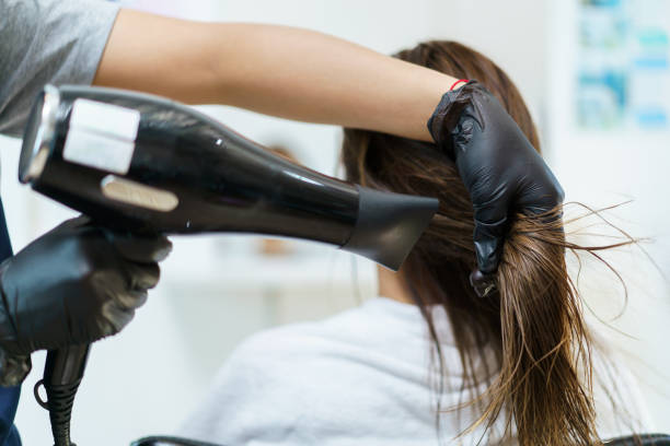 istock Woman having a hair dressing at salon 1616732337