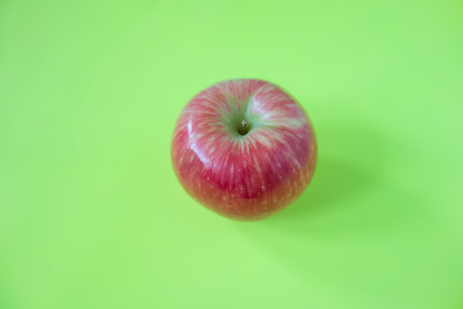 Group of fresh organic red apple on green background