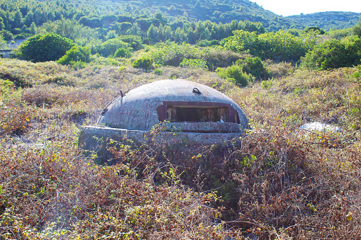 Explore history's remnants with a glimpse of an abandoned defense bunker on Sazan Island in Vlorë, Albania. A silent witness of past times.