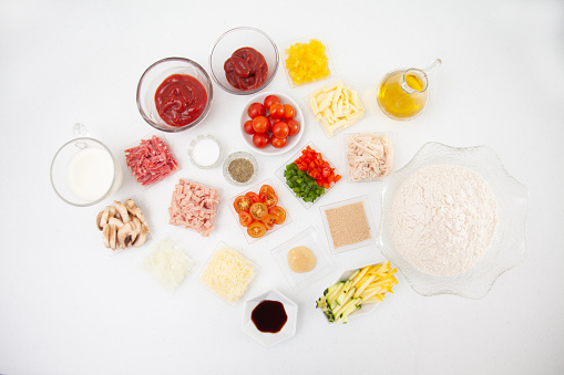 Pizza topping ingredients. Pizza preparation.