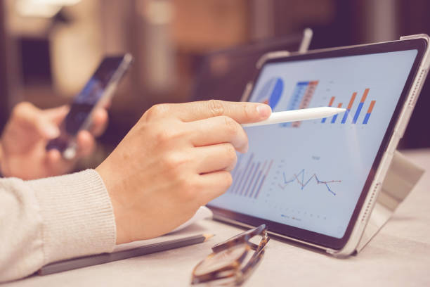 istock close up senior manager man hand use stylus pencil to point chart report dashboard on digital tablet for checking about financial and profit of company yearly for business lifestyle concept 1616758237