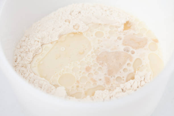 istock Adding leavened yeast. Home made pizza dough preparation. Pizza preparation. 1616770870