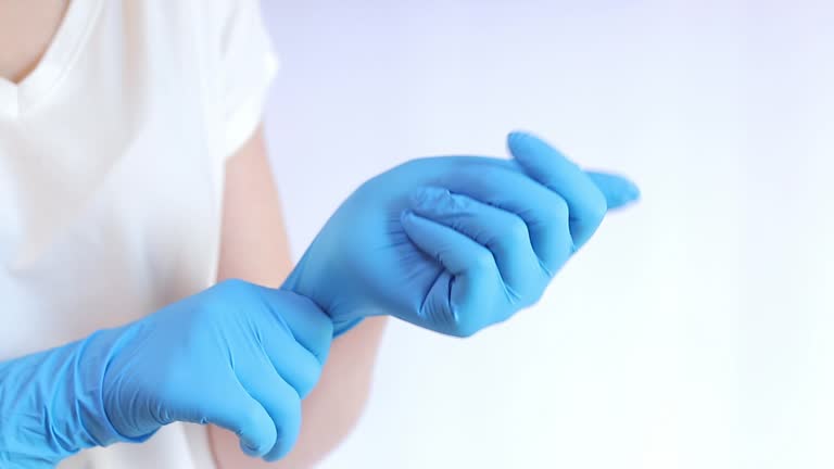 Hands in latex medical gloves. Doctor or nurse wearing nitrile protective glove