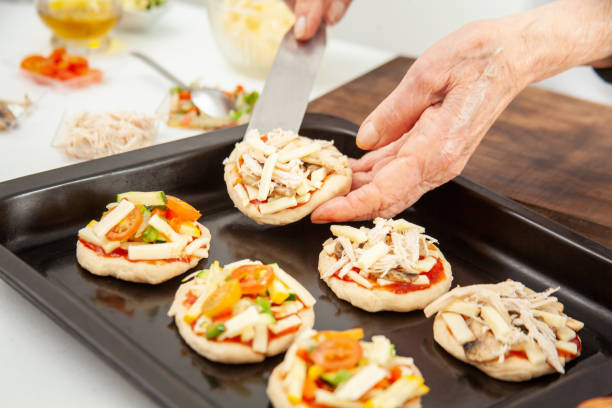 istock Ready to be baked mini pizzas. Delicious home made mini pizzas preparation. 1616801297