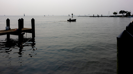 Harbor on water Bay covered by a hazy smog after Canadian fires. Dock on Severn River in Annapolis, Maryland