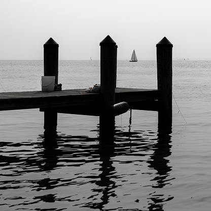 Dock of Annapolis Bay covered by a hazy smog after Canadian fires. Pier on Severn River in Annapolis, Maryland