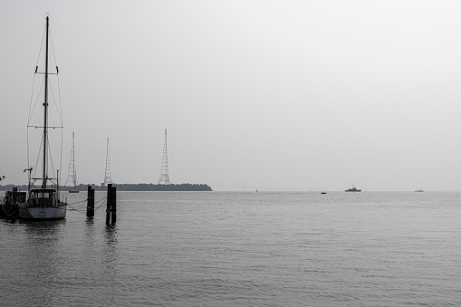Pier of Annapolis Bay covered by a hazy smog after Canadian fires. Dock on Severn River in Annapolis, Maryland
