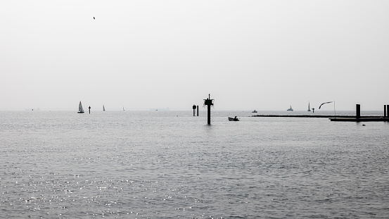Pier of Annapolis Bay covered by a hazy smog after Canadian fires. Dock on Severn River in Annapolis, Maryland