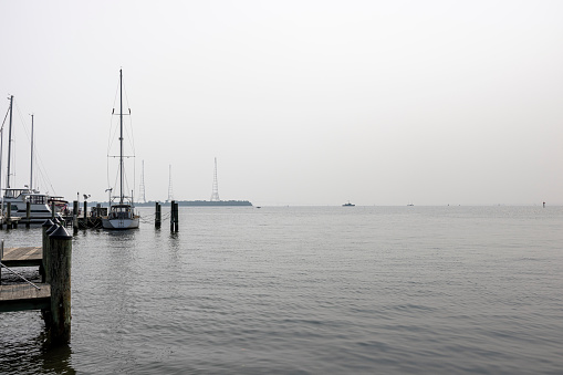 Harbor of Annapolis Bay covered by a hazy smog after Canadian fires. Dock on Severn River in Annapolis, Maryland