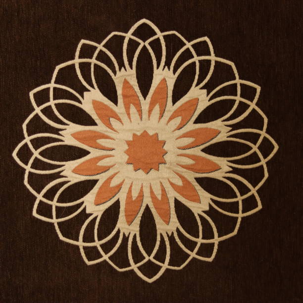 istock Mandala Pattern on the brown Fabric with orange And skin colour 1616829211