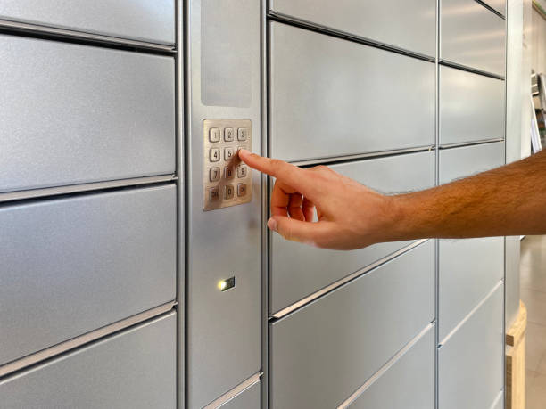 istock A man presses buttons on a self-service terminal for automatic parcel delivery 1616860676