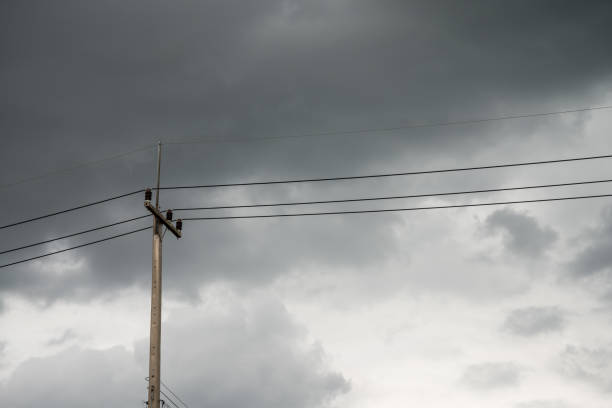 istock Torrential rain dark clouds is coming with electricity post. 1616868203