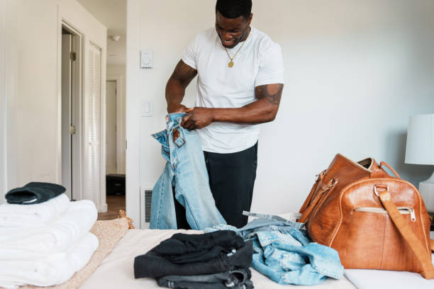 istock Man packing luggage for trip 1616872416