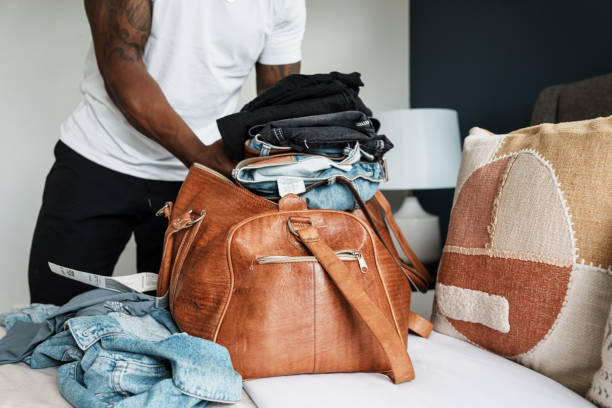 istock Man packing luggage for trip 1616872774