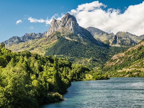 View of the village of Sallent de Gállego with the Pico Peña Foratata from the Lanuza reservoir, Huesca, Spain