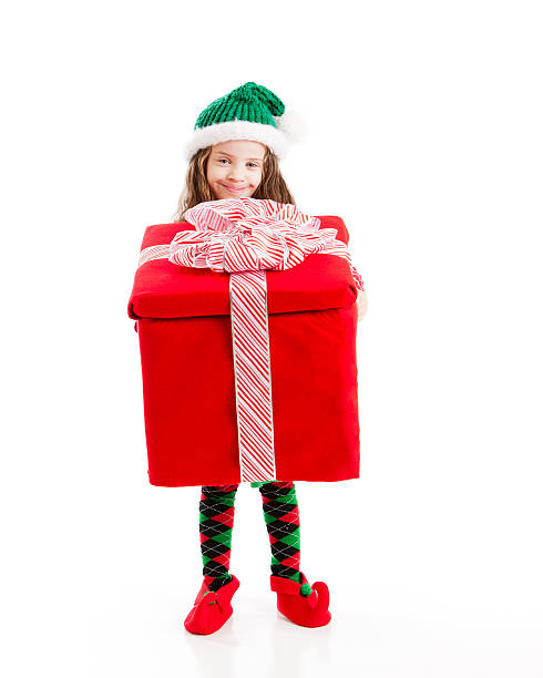 istock Young Christmas Elf Holds a Big Present 161688371