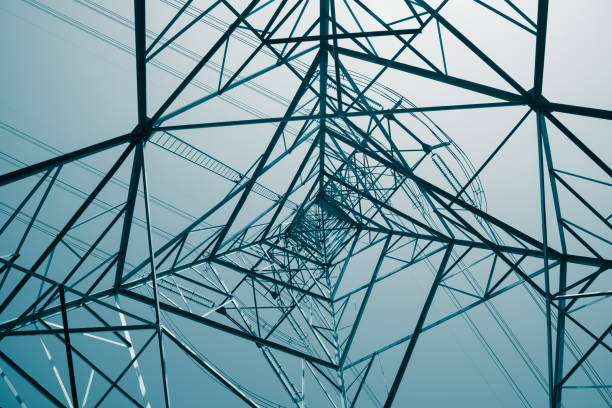 istock Abstract pattern from bottom view of high voltage pole power electricity transmission tower post. 1616891726
