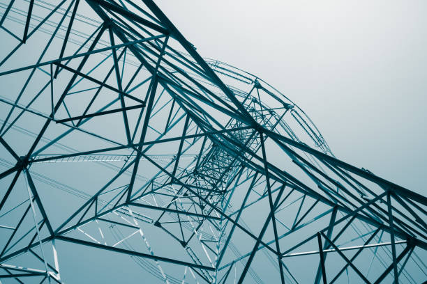 istock Abstract pattern from bottom view of high voltage pole power electricity transmission tower post. 1616891741