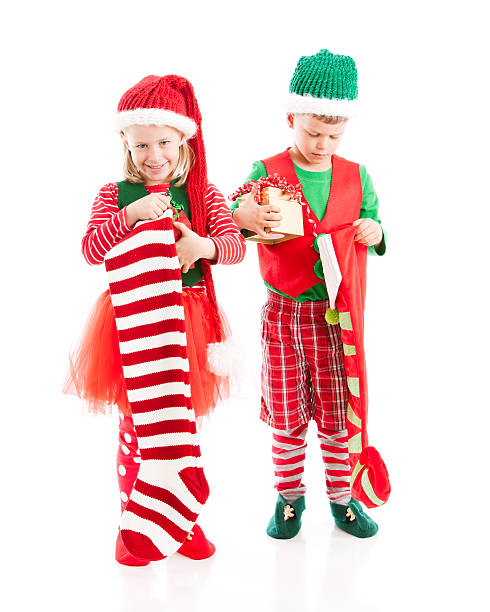 istock Two Christmas Elves Carry a Big Heavy Wrapped Present 161689238