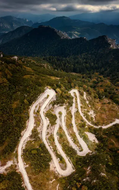 Wonderful bike route Tremalzo near Lago Garda with Apls in background, Italy