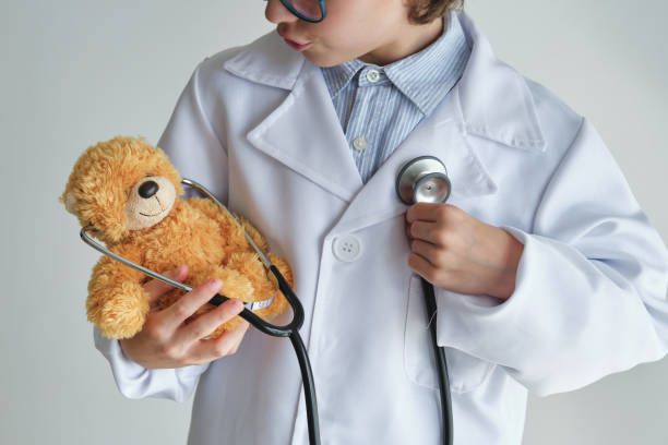 istock Crop boy doctor with toy bear and stethoscope 1616916777