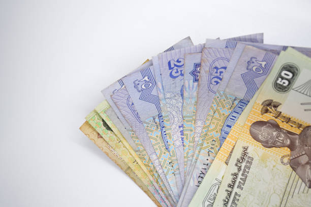 istock egyptian money change cash, white background, copy space 1616918952