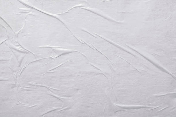 istock Abstract paper background with folds. 1616922119