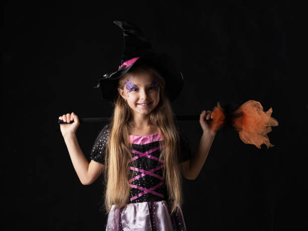 istock Cute halloween witch girl 1616954206