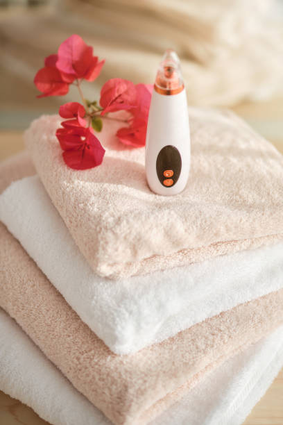 istock Vacuum acne cleaner on towels with flowers 1616956045