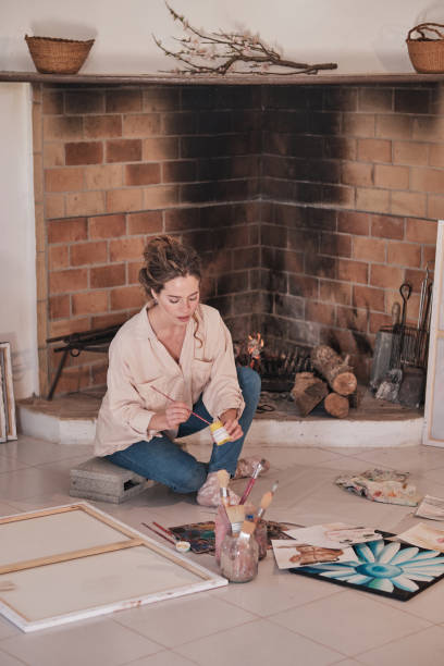 istock Female artist painting in modern studio 1616976374